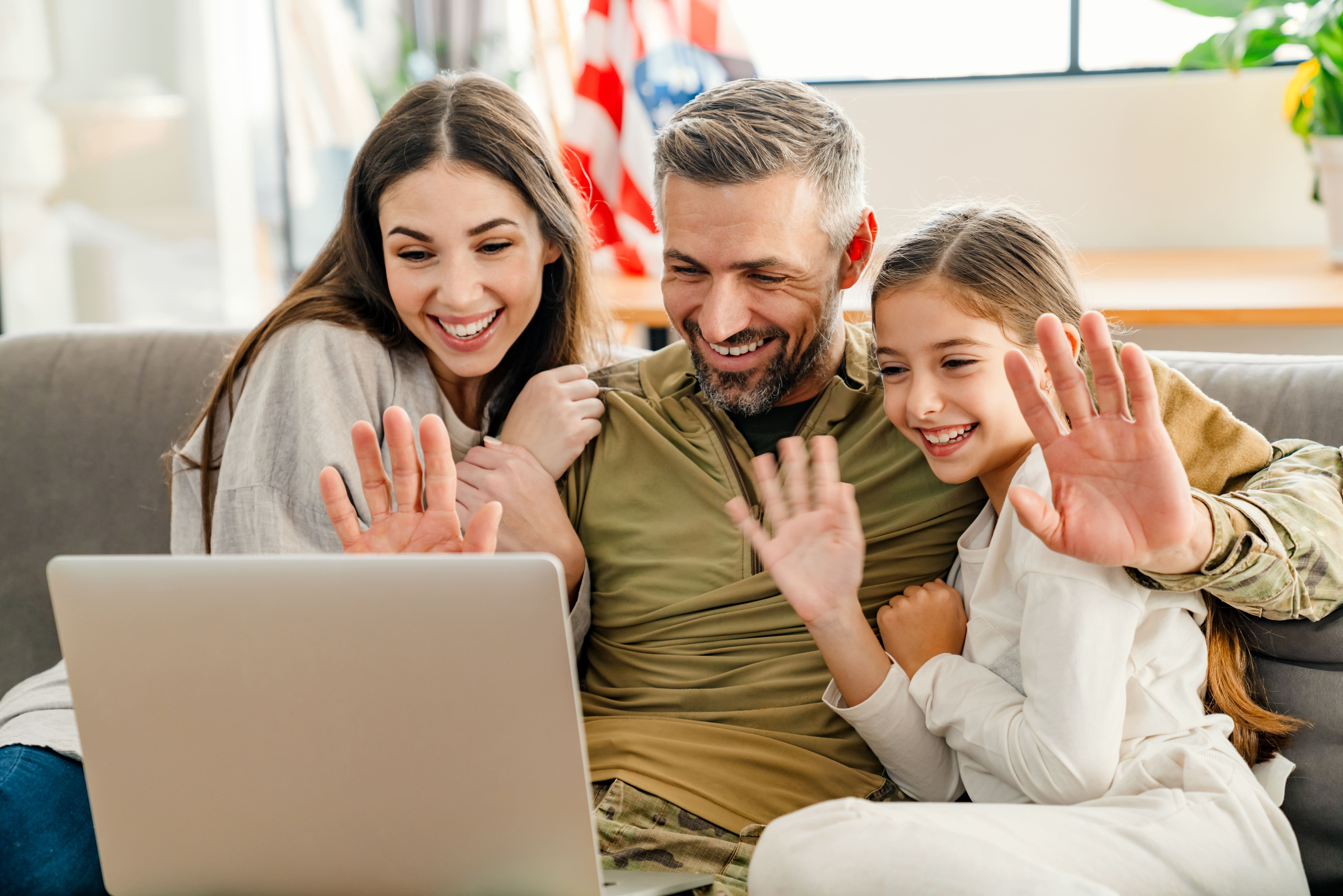 Family accessing virtual healthcare from home on computer